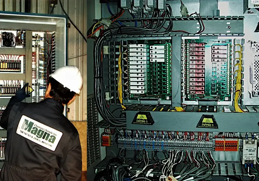 Man installing Vappro 5 and Vappro 10 VCI emitters in large electrical panels