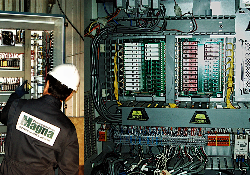 Man installing Vappro 5 and Vappro 10 VCI emitters in large electrical panels