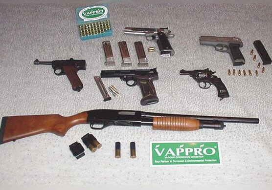 Assotment of firearms lying on a table
